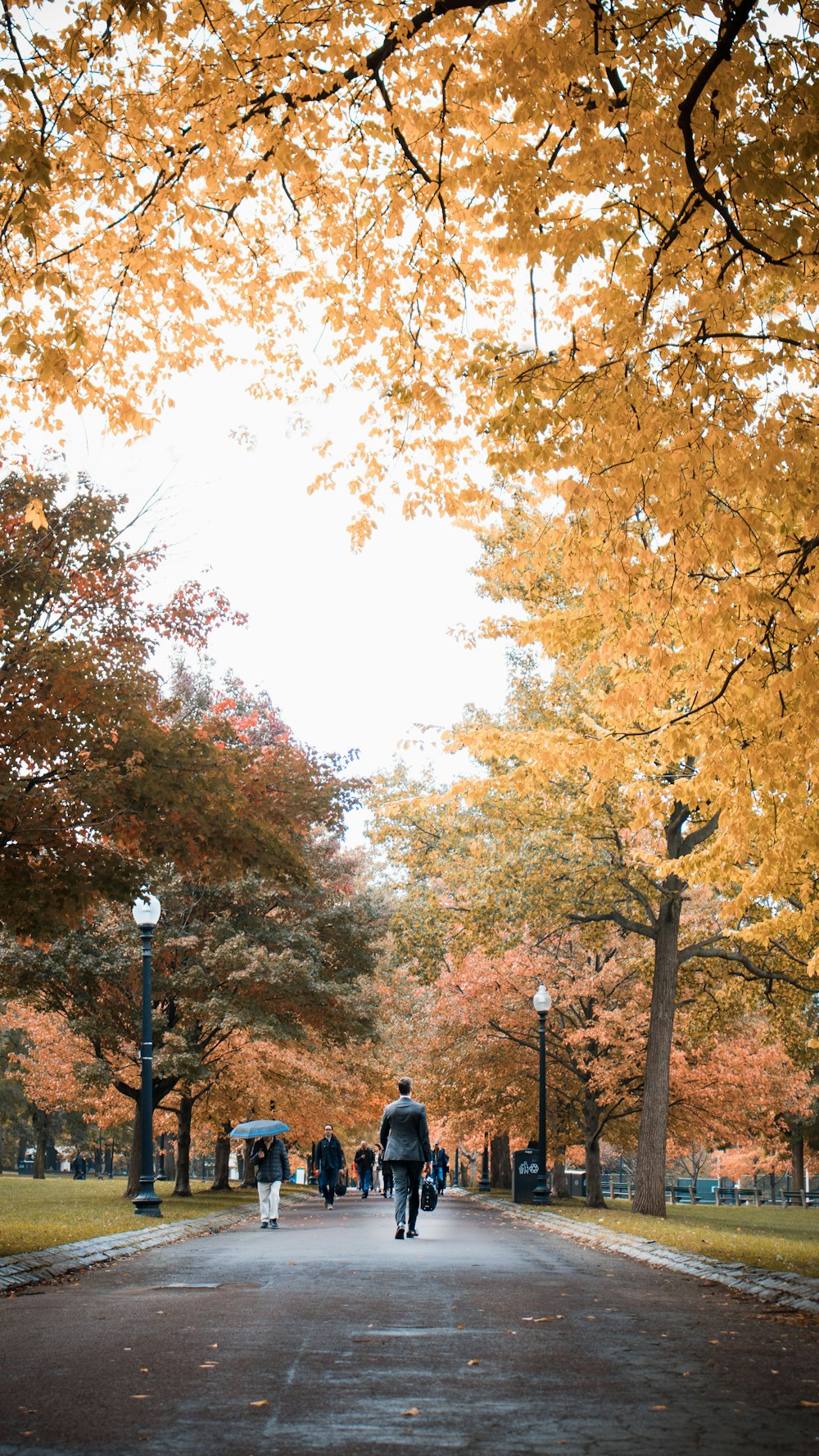 man walking on footpath