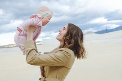 woman carrying child mother google meet background