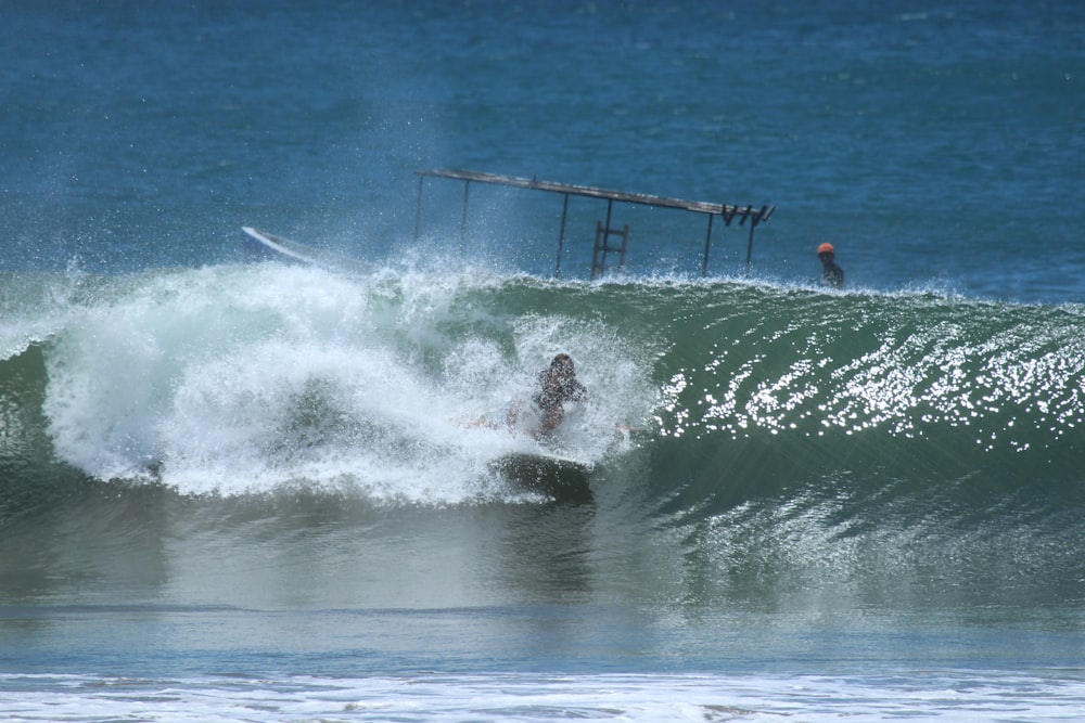 man surfing on the wave