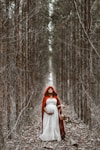 woman holding basket standing on pathway