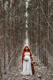 woman holding basket standing on pathway