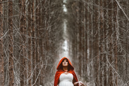 woman holding basket standing on pathway