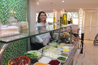 A bright, clean canteen counter displaying fresh salads and wholesome snacks.