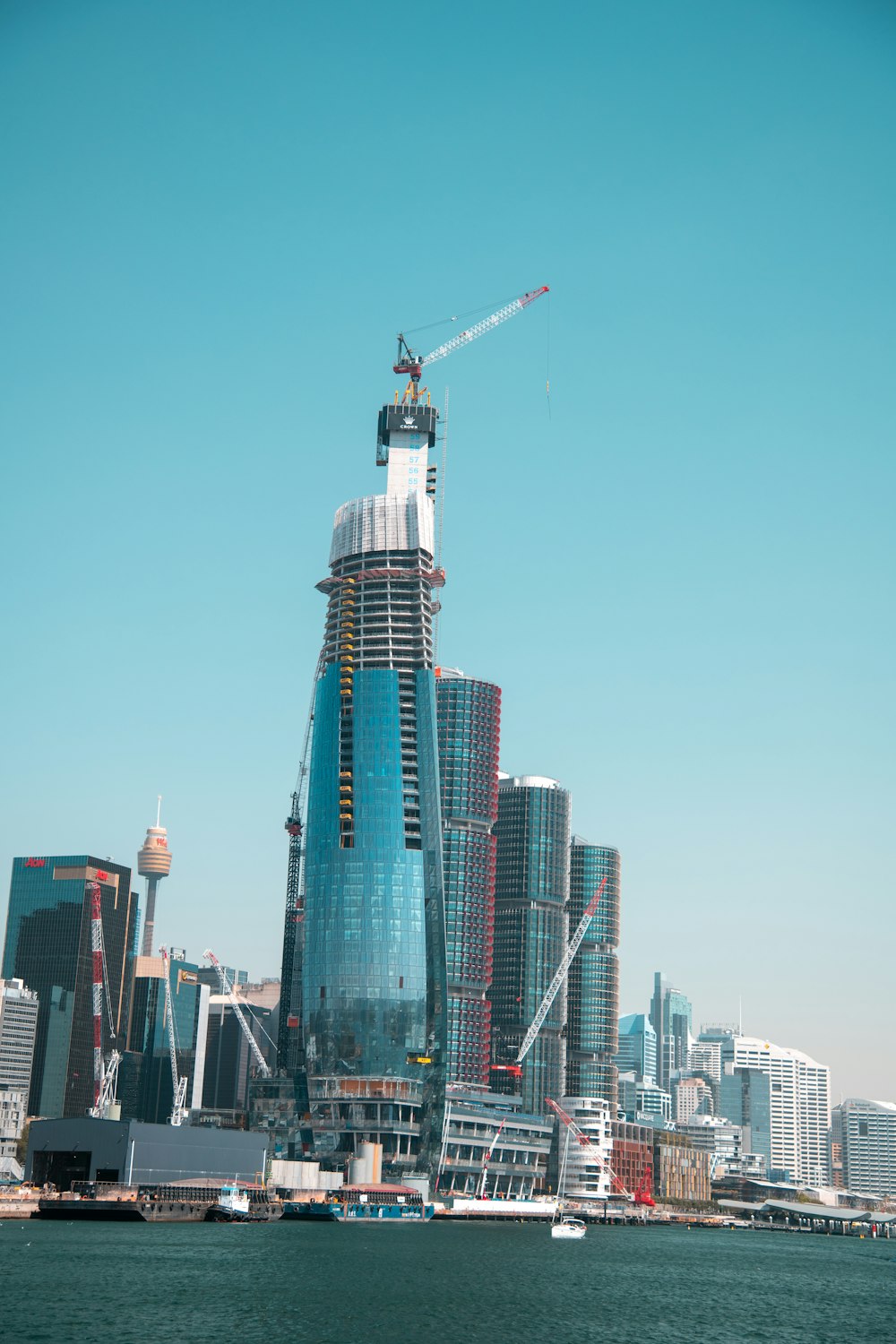 a very tall building with a crane on top of it