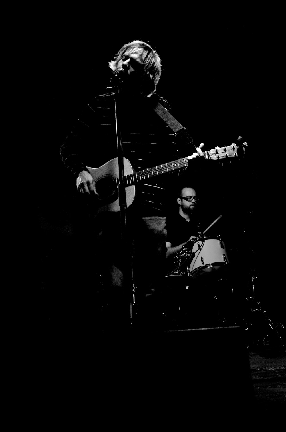 person performing in greyscale photography