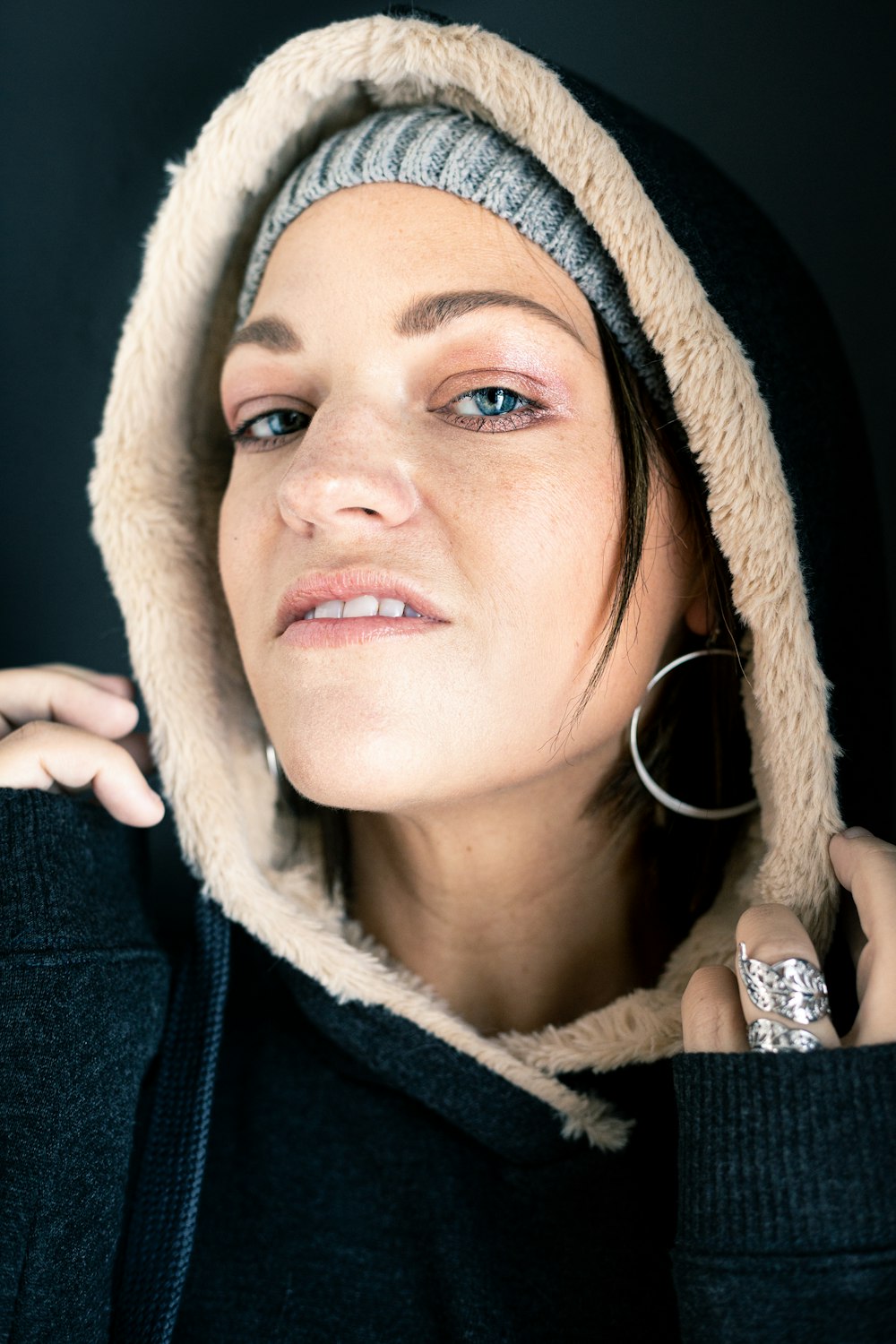 woman wearing black and brown fur hoodie