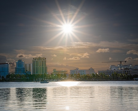 body of water beside concrete building during daytime