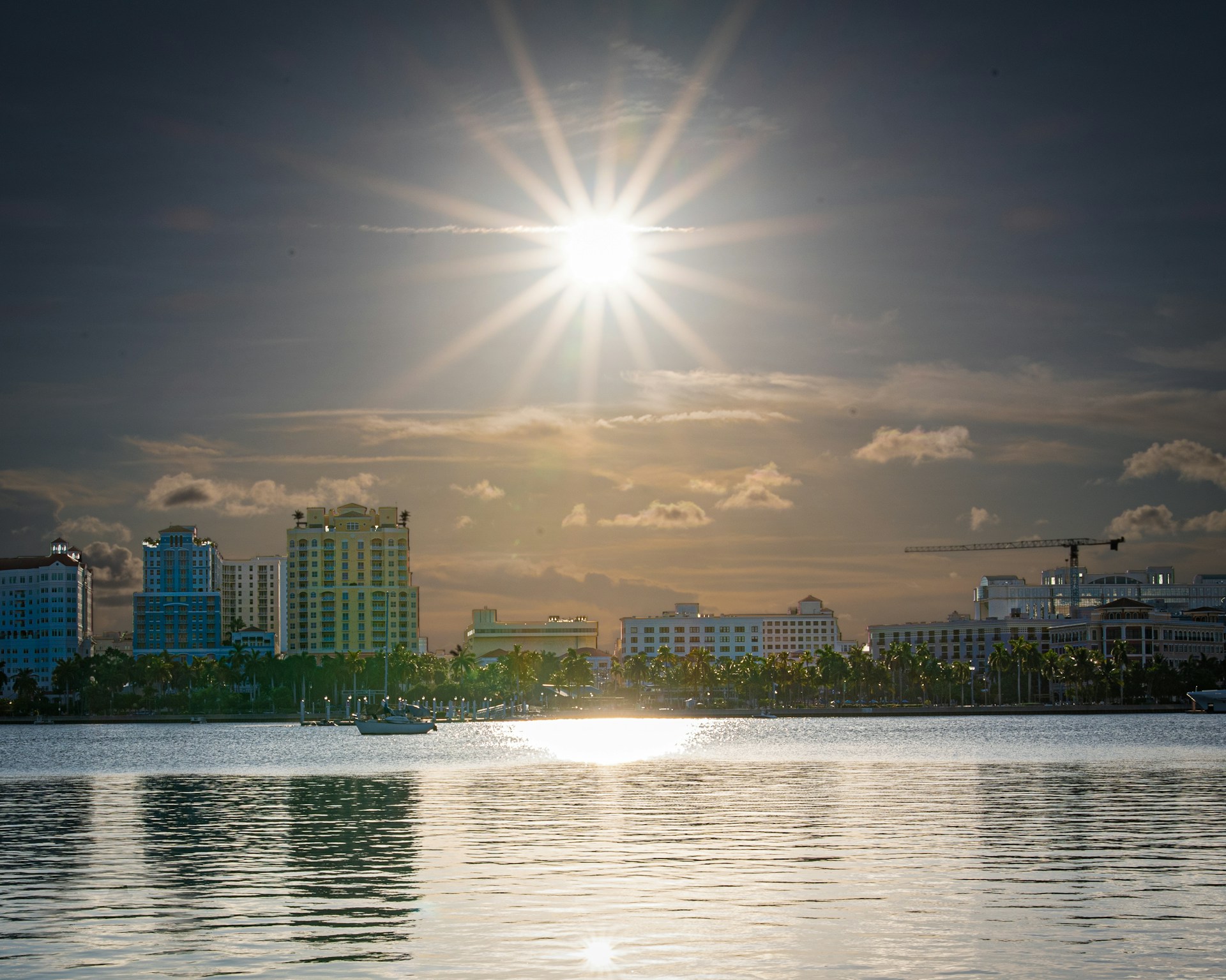 body of water beside concrete building during daytime