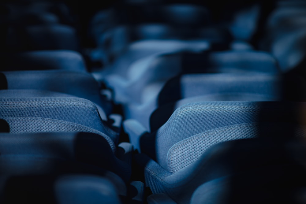 a row of blue seats sitting next to each other