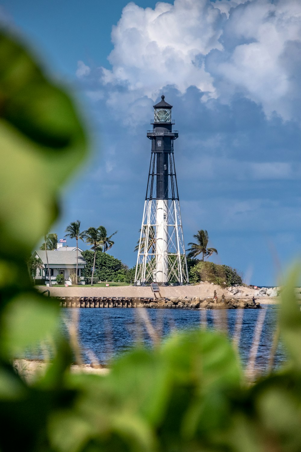 black and white metal lighthouse during daytime