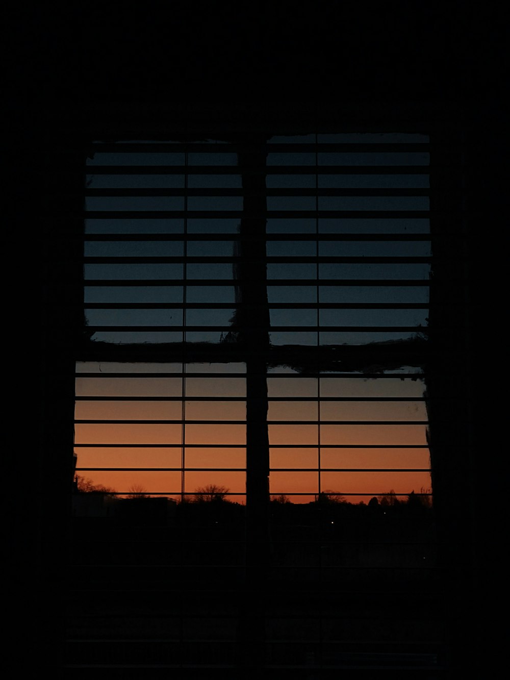 low-light photo of open window blinds