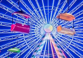 Colorful spinning wheel with bright segments and a glowing pointer.