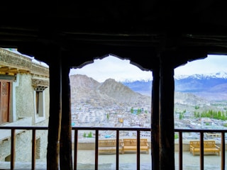 Panoramic view of the Dolomite mountains from a cozy apartment balcony.