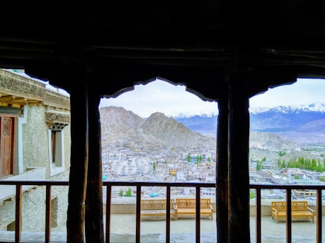Panoramic view of the Dolomite mountains from a cozy apartment balcony.