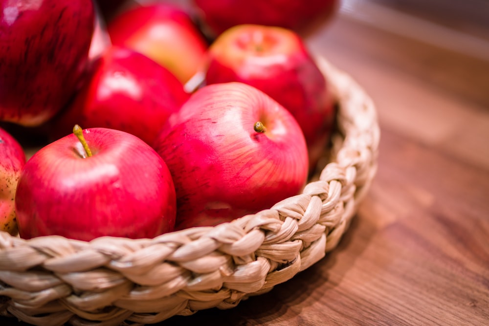 red apples in brown wicker baskets