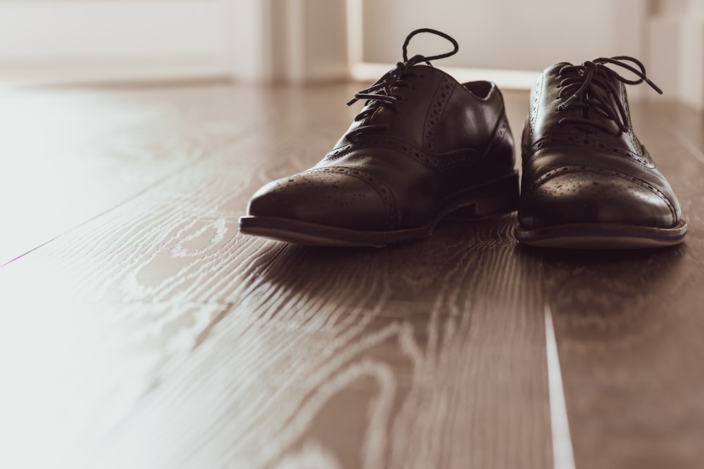 pair of brown wingtip shoes