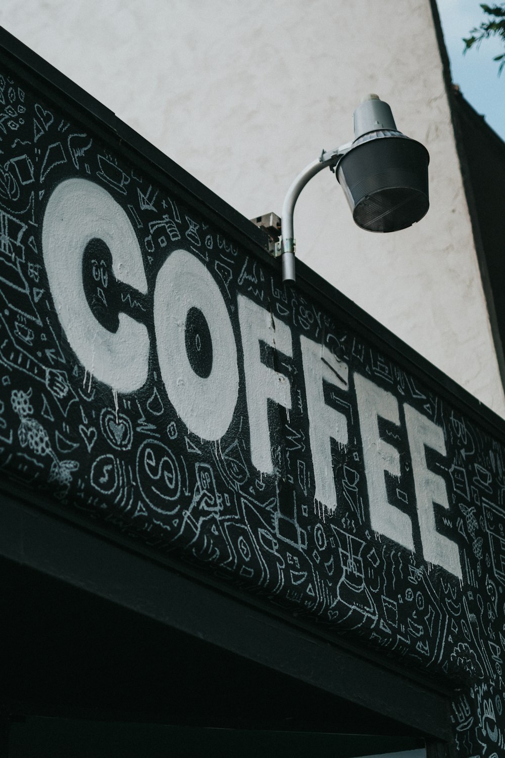 coffee painted on the black wall