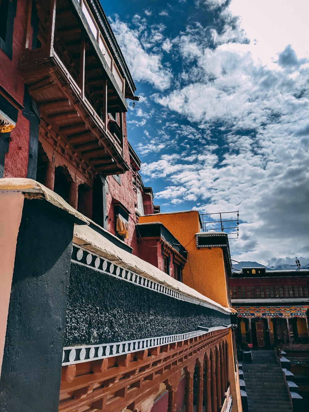 brown and maroon concrete multi-story building during daytime