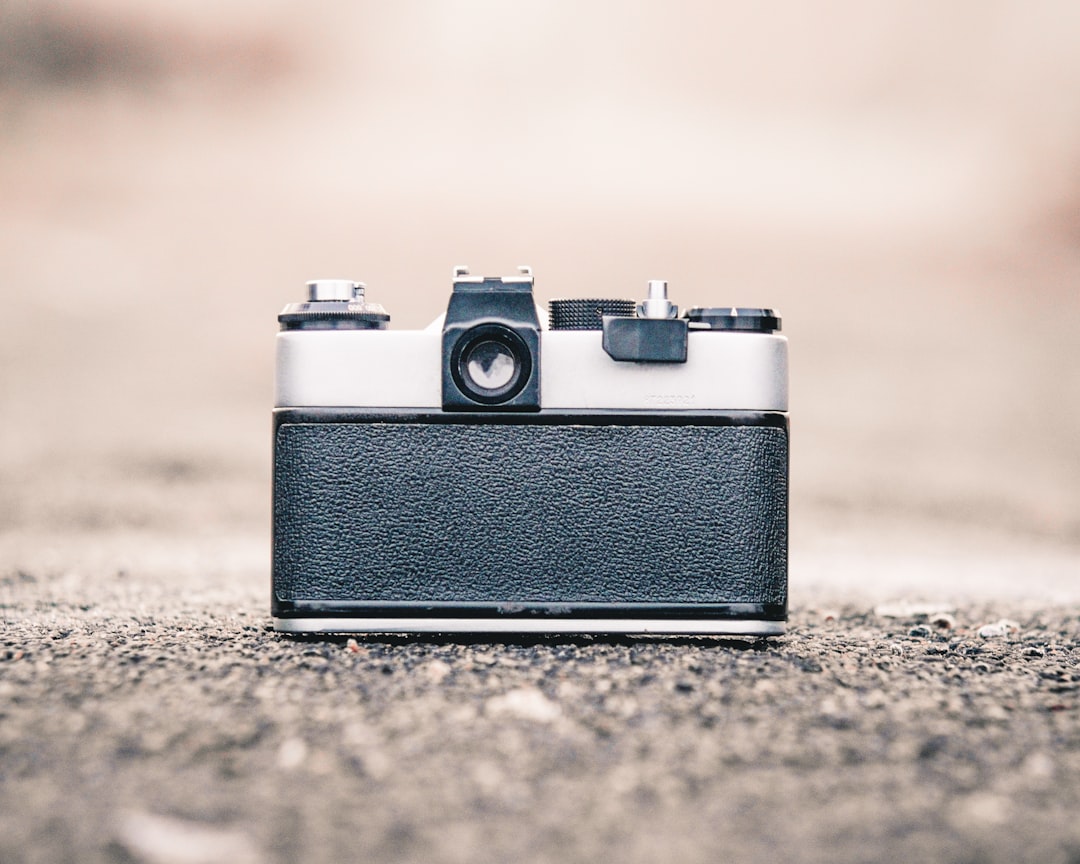 selective focus photography of gray and black camera during daytime