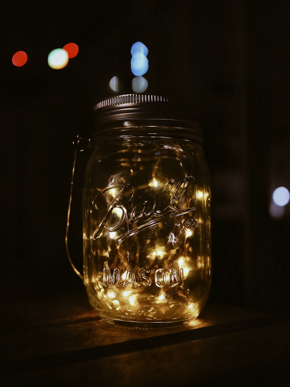 string lights on clear glass mason jar