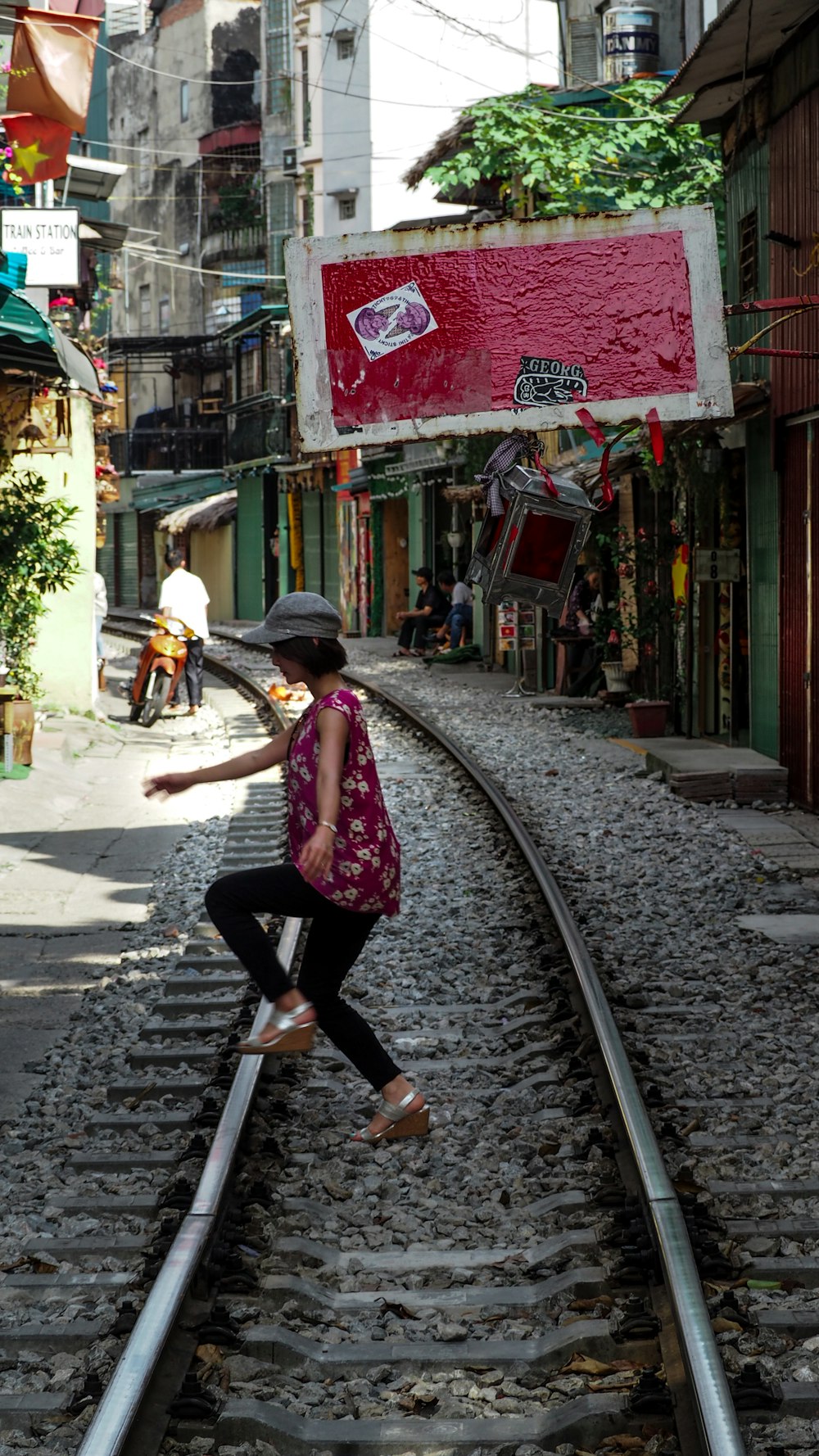 woman jump over the railroad