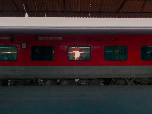 A friendly customer service agent holding a phone, ready to assist with AutoTrain bookings.