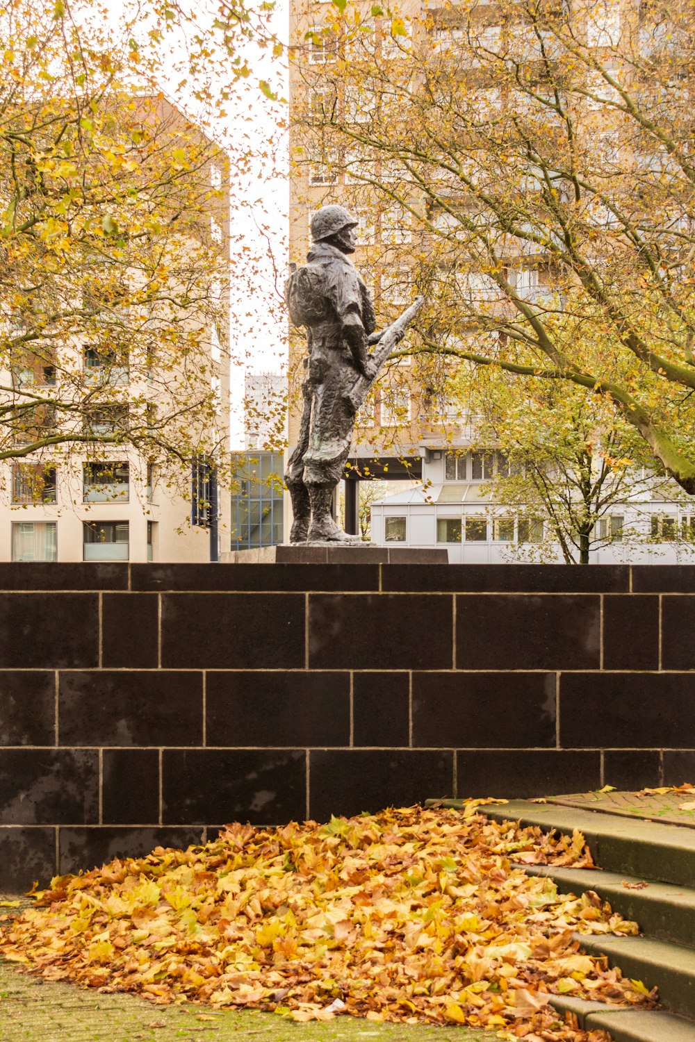 soldier grey concrete statue during daytime