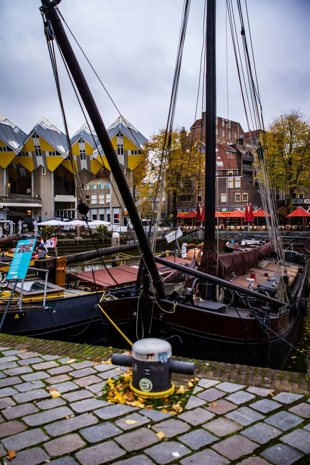 boat tied on dock during daytime