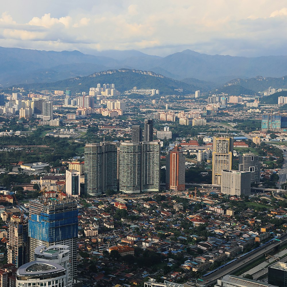 areal photo of city near mountains during daytime