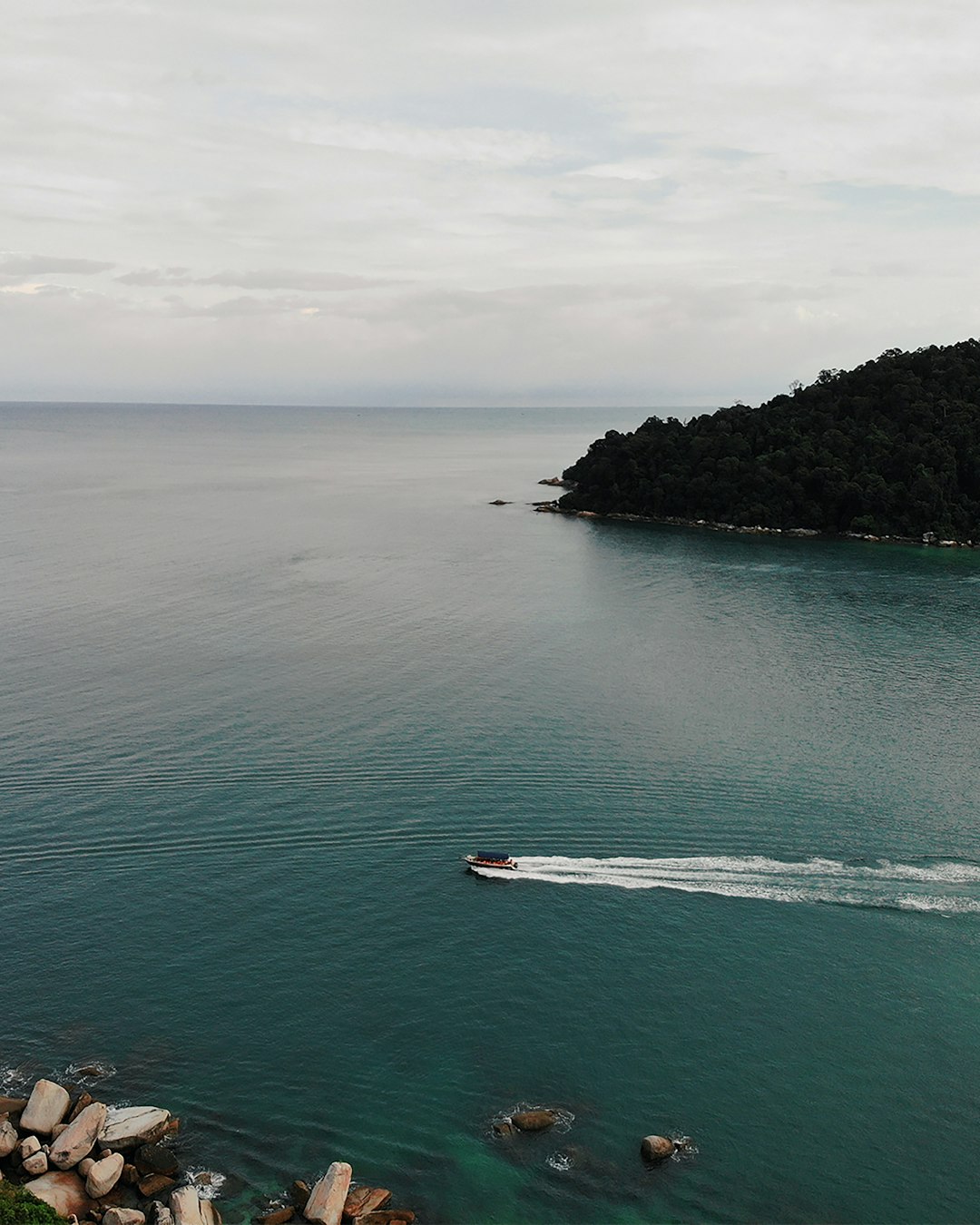 boat in body of water near island