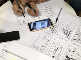 black Android smartphone and pink case