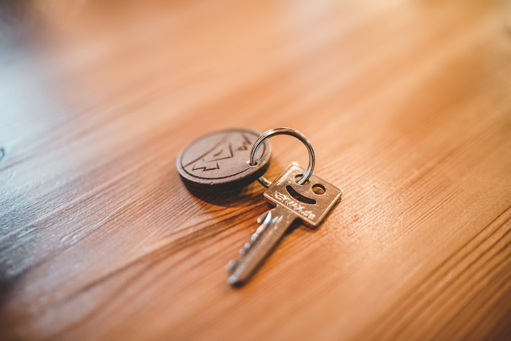 silver key on tabletop