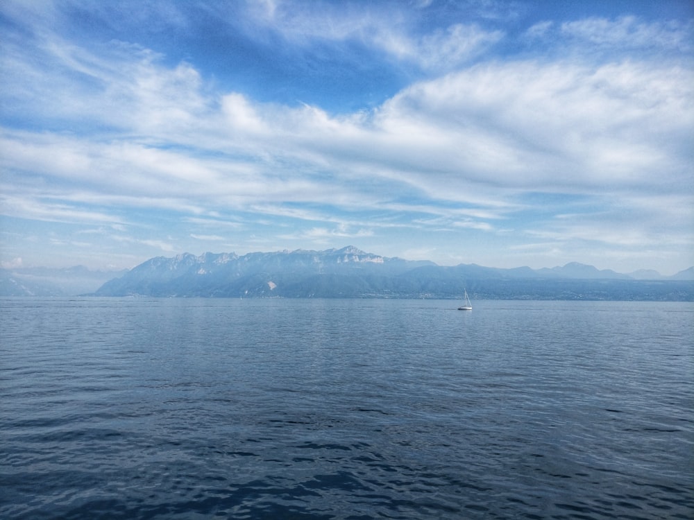 ocean under cloudy sky