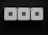 Three square metallic boxes with the word 'TOUCH' on each are aligned horizontally against a dark background. Each box has four evenly spaced screws at the corners, giving a symmetrical and industrial appearance.