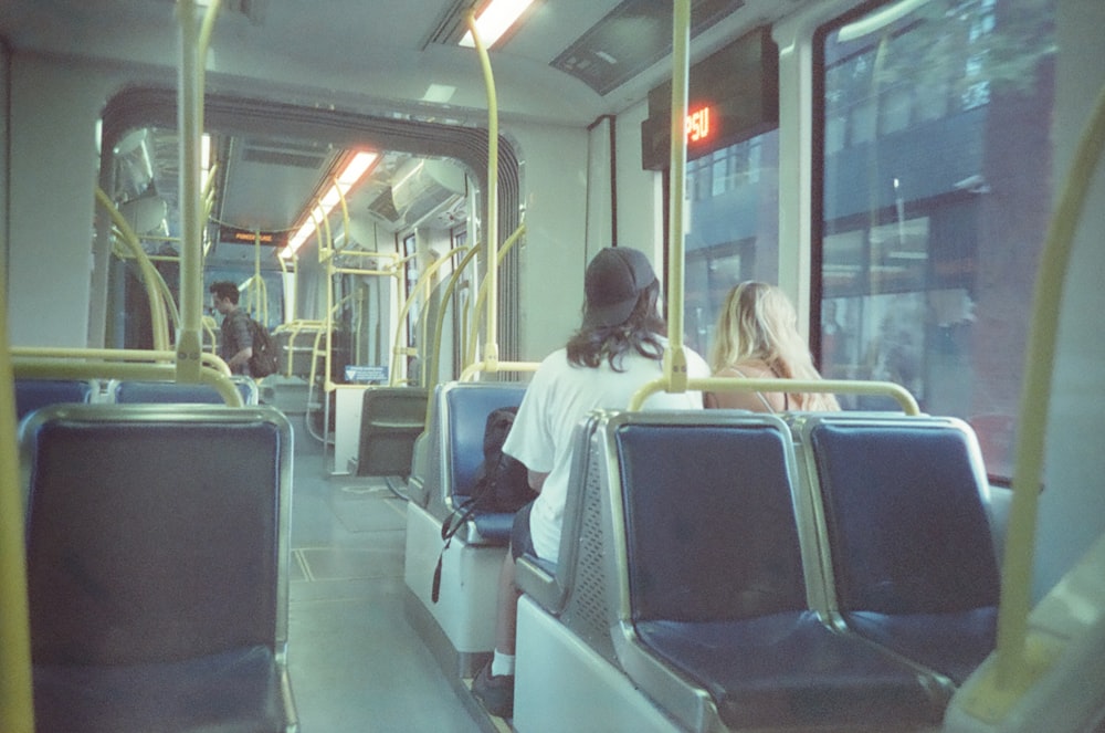 person riding train during daytime