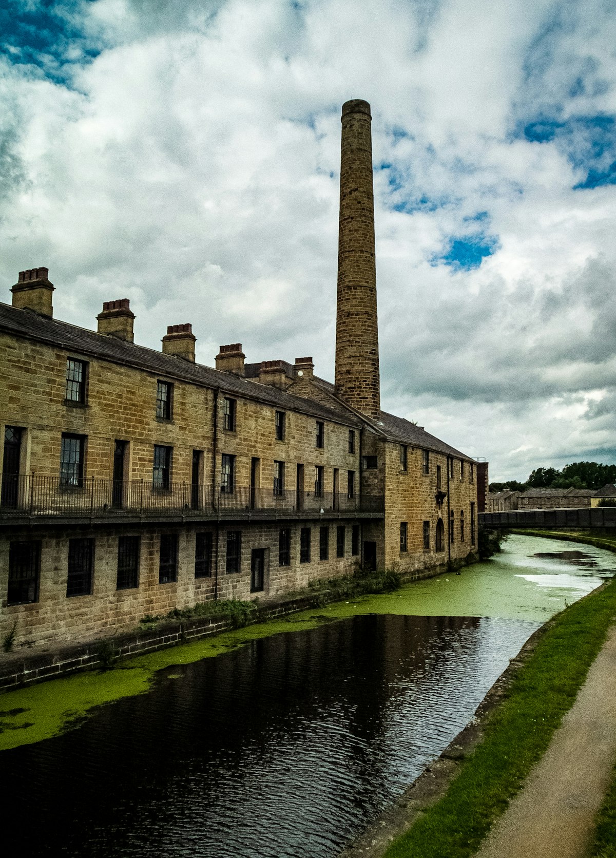 Historic stone mill-town architecture in Burnley, Lancashire under a bright sky