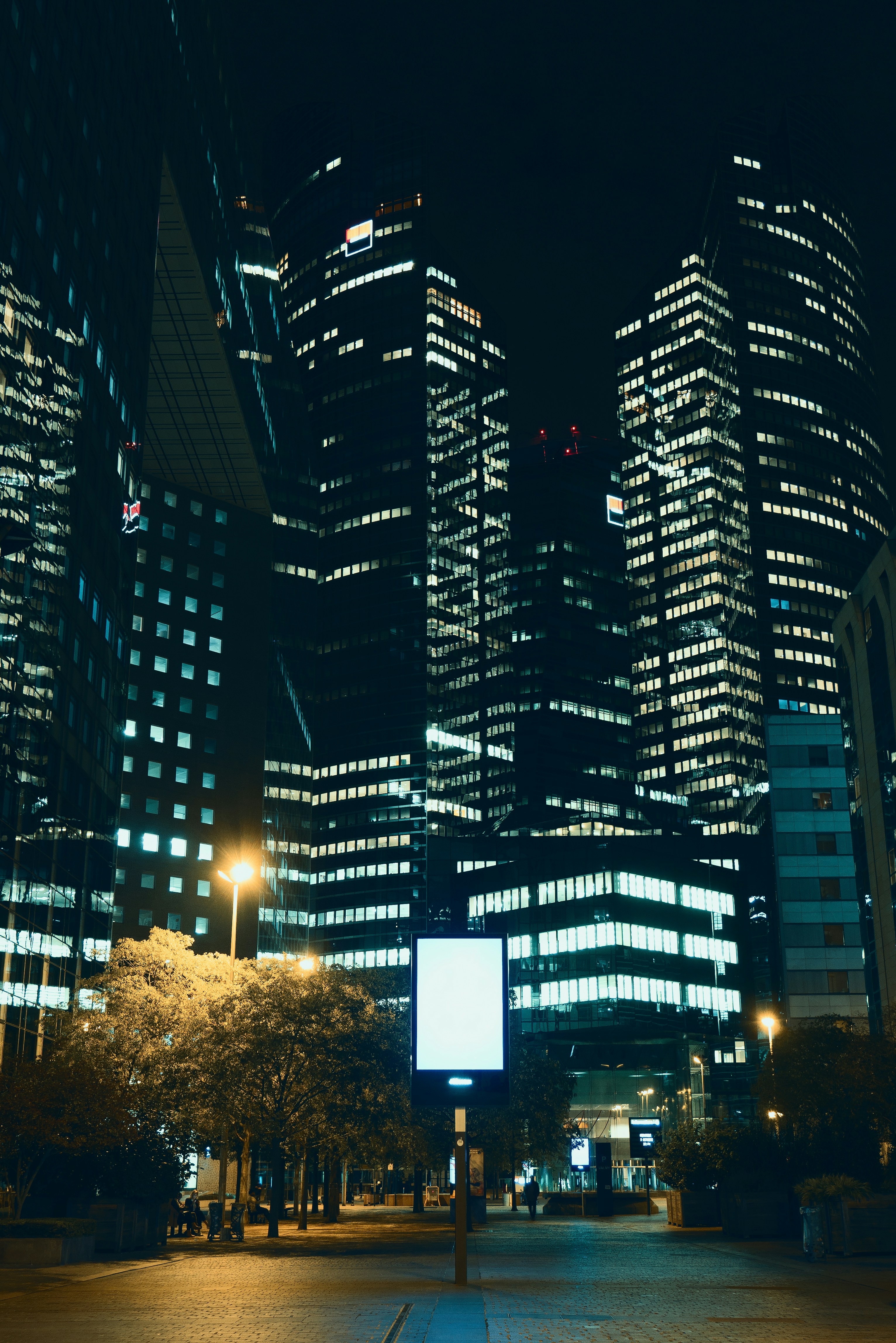 lighted buildings near street during night