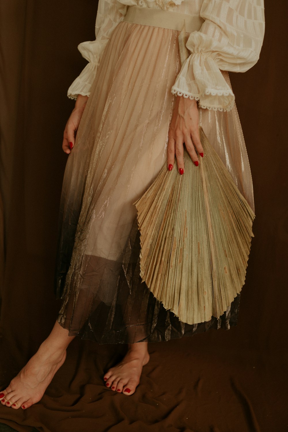 woman wearing brown long-sleeved dress