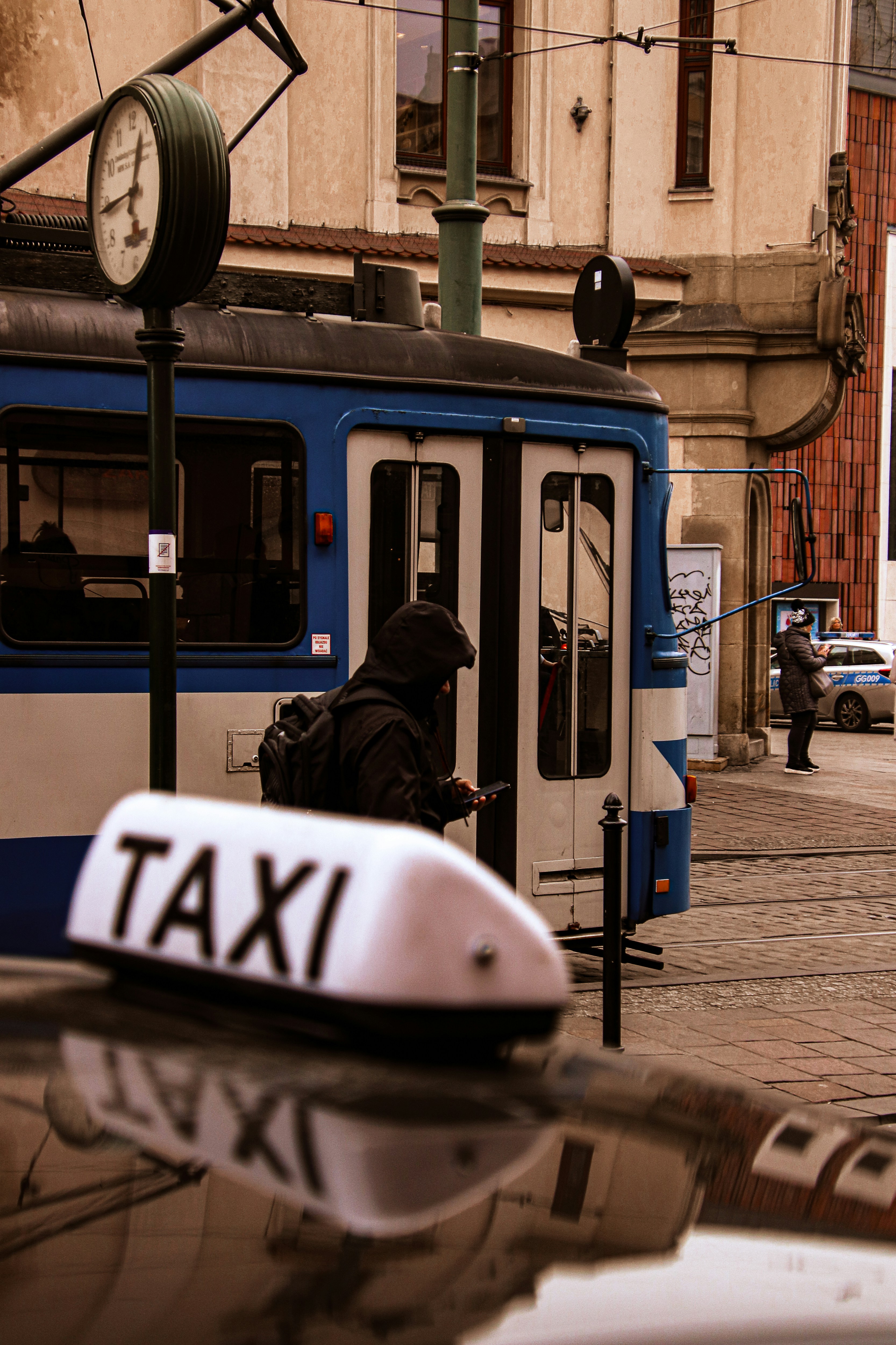 Passenger reviewing travel itinerary on their phone in a taxi