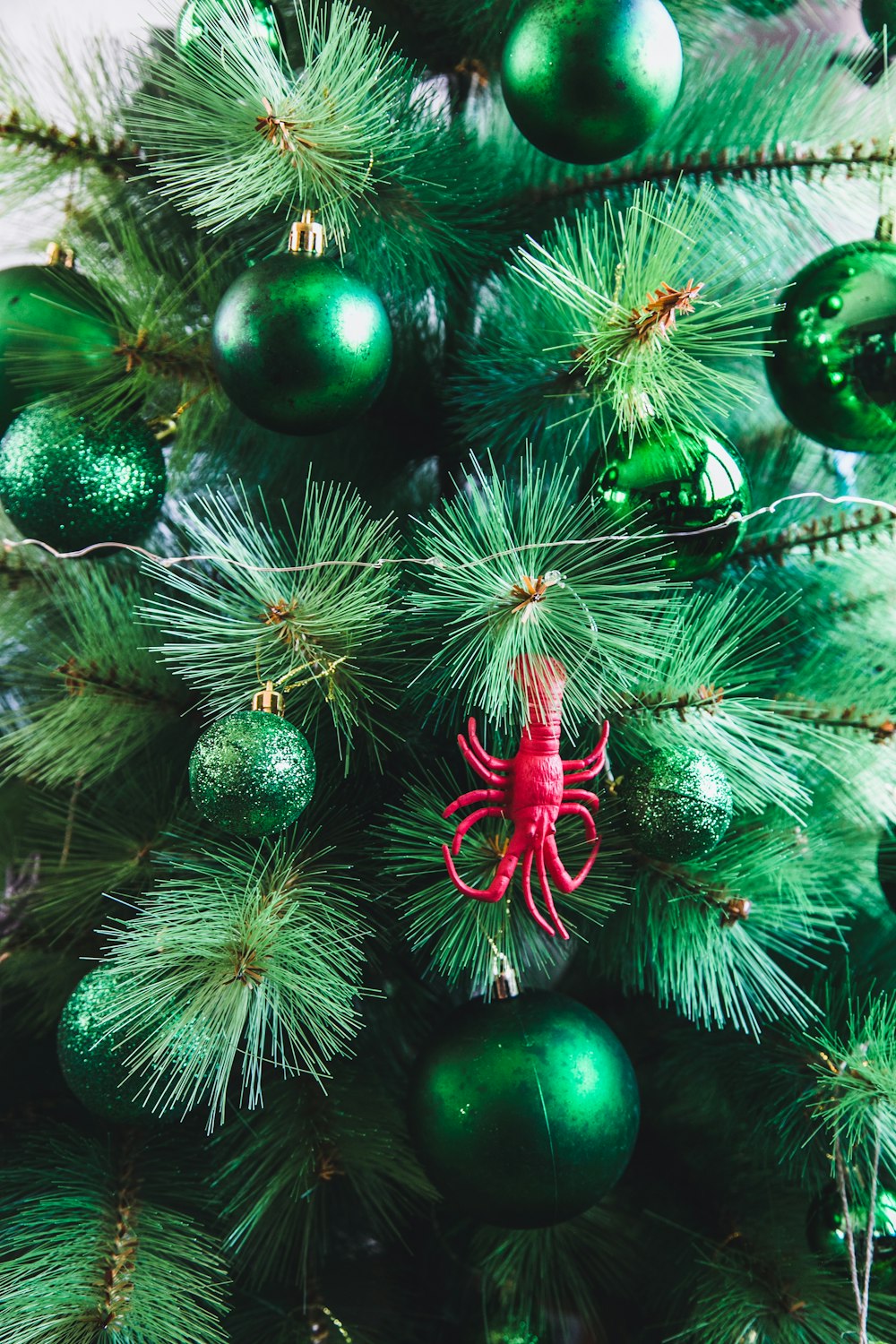 green baubles on Christmas tree