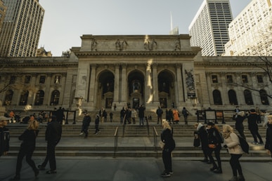 people walking near New York Public library during daytime