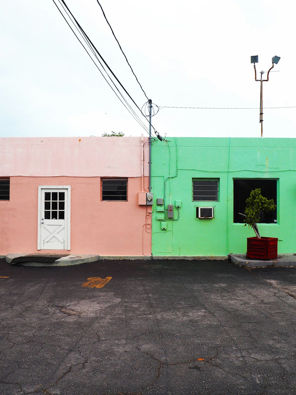 two green and pink concrete houses