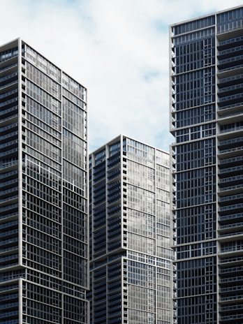 high-rise buildings under white and blue sky