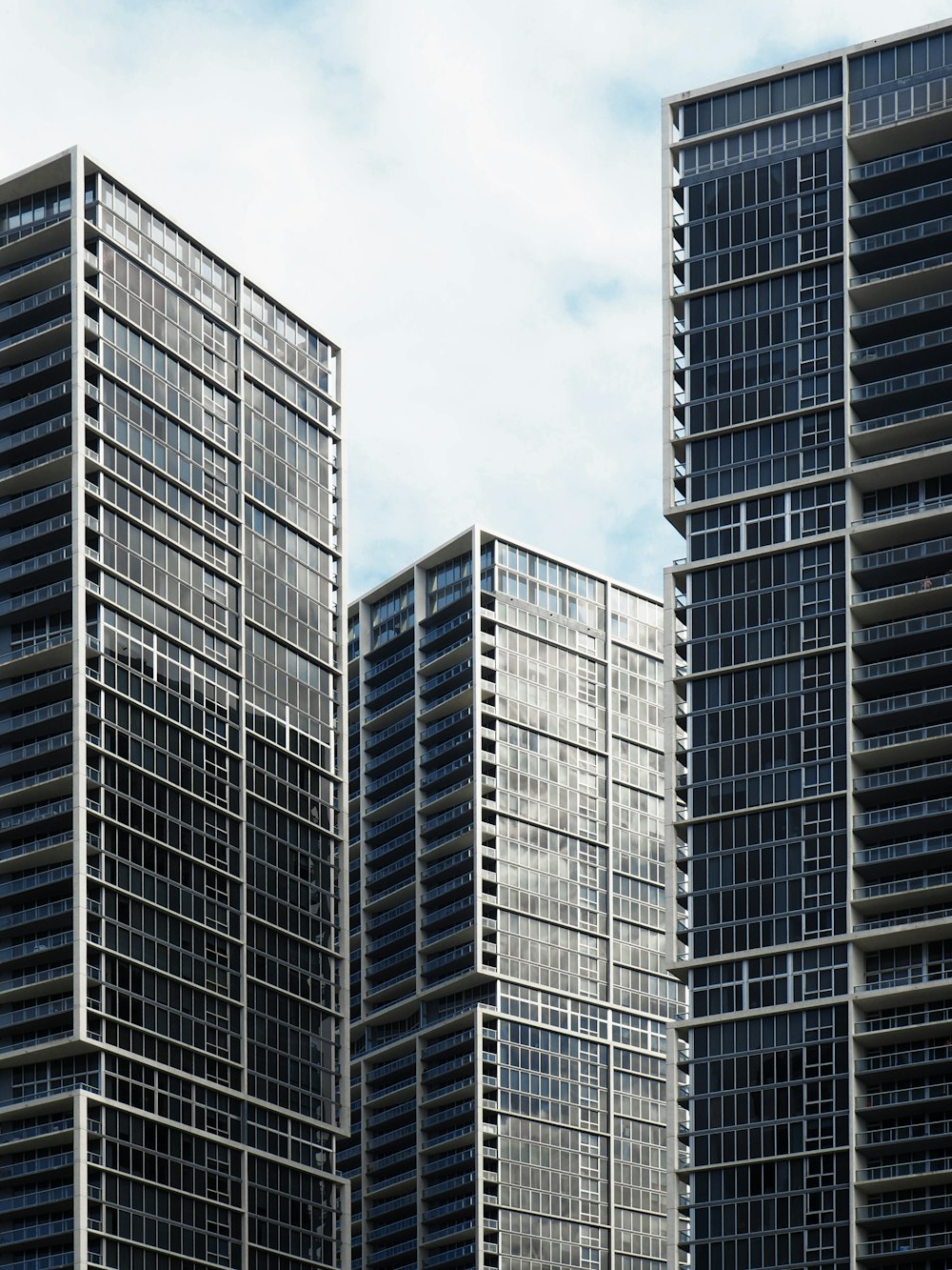 high-rise buildings under white and blue sky