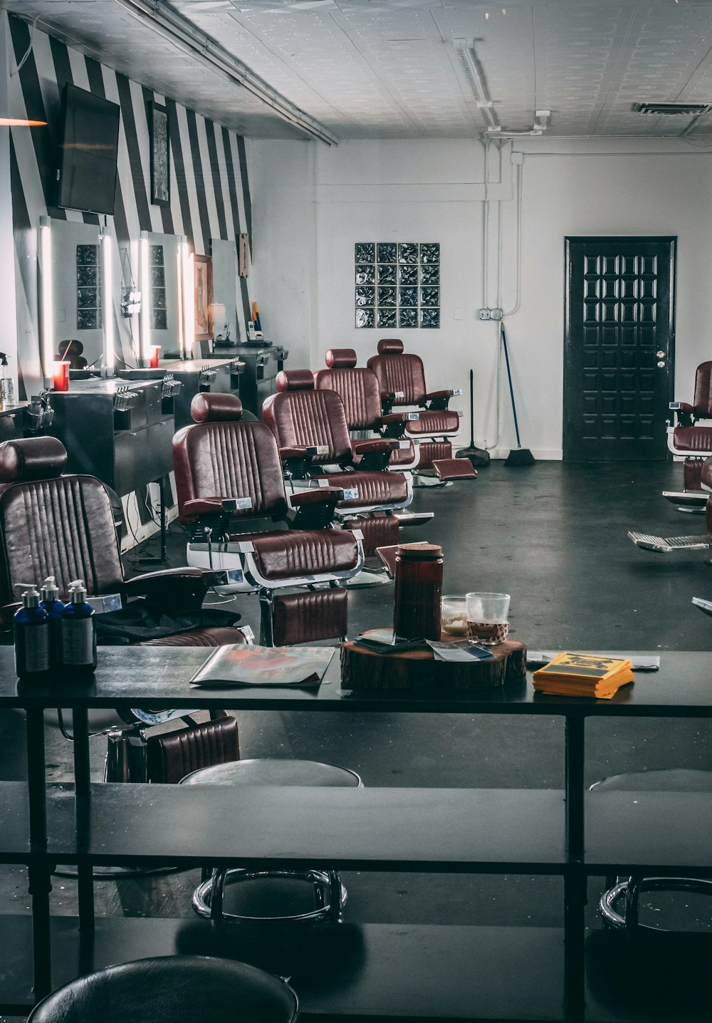 brown leather barber chairs in room