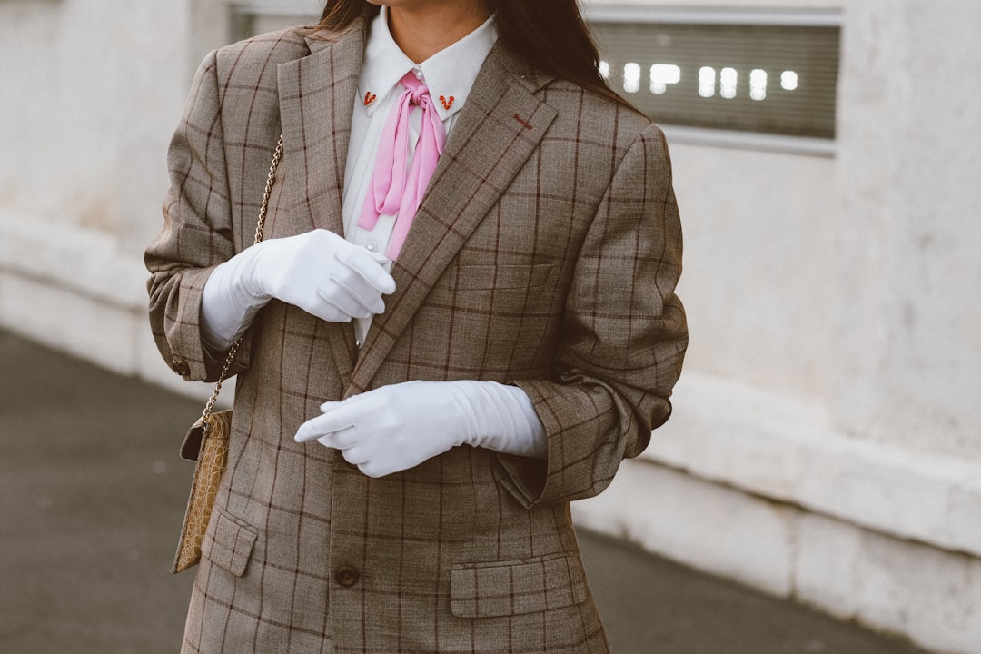 woman wearing grey checkered coat