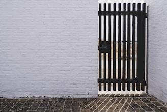 black gate panel with black metal gate latch