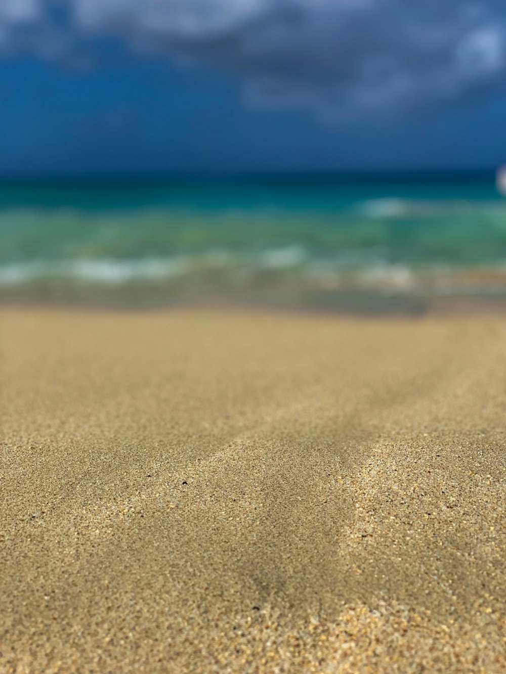 sand seashore during day