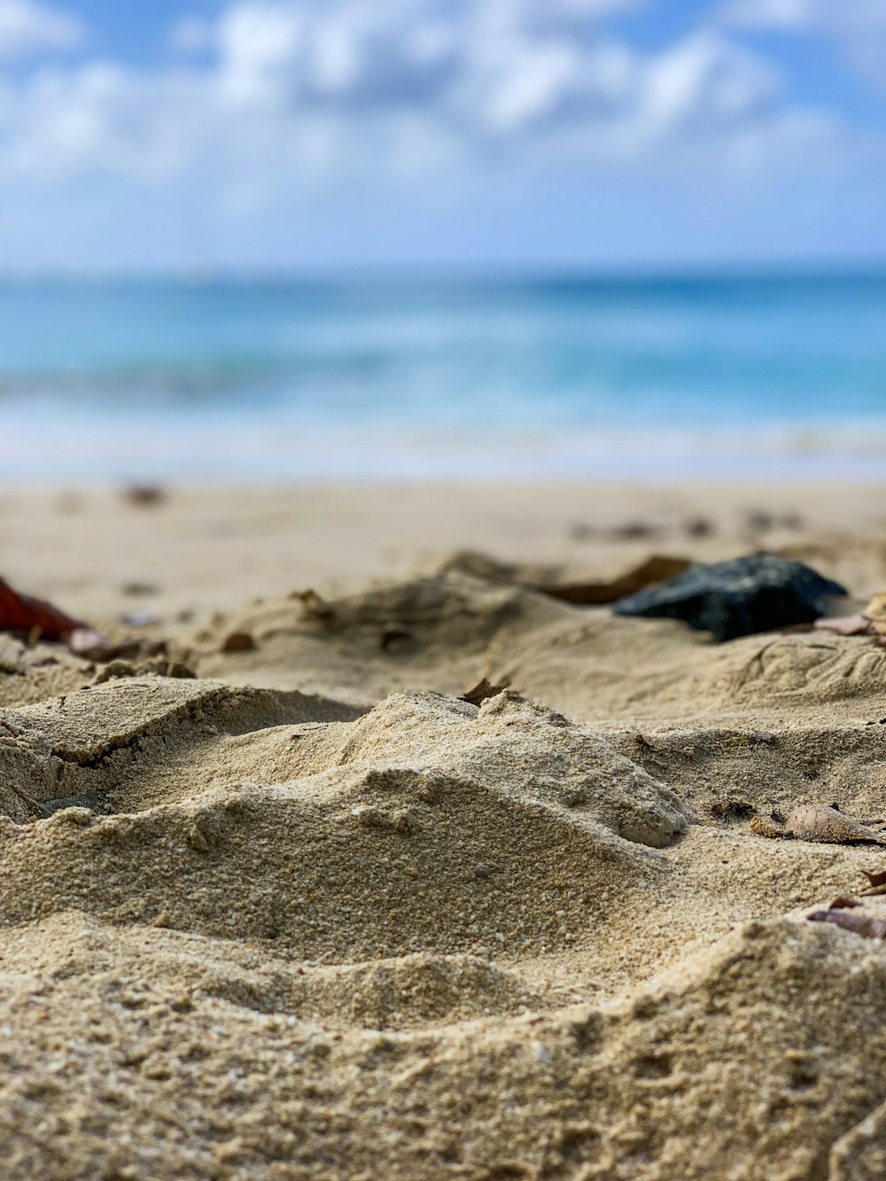 sand seashore during day