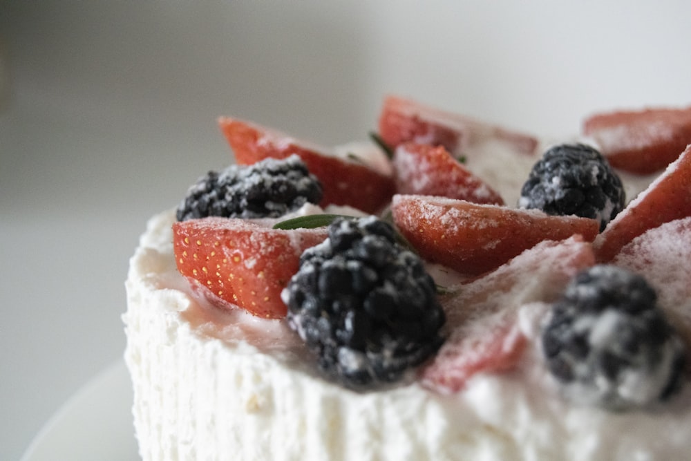 selective focus photography of strawberry and raspberries pastry